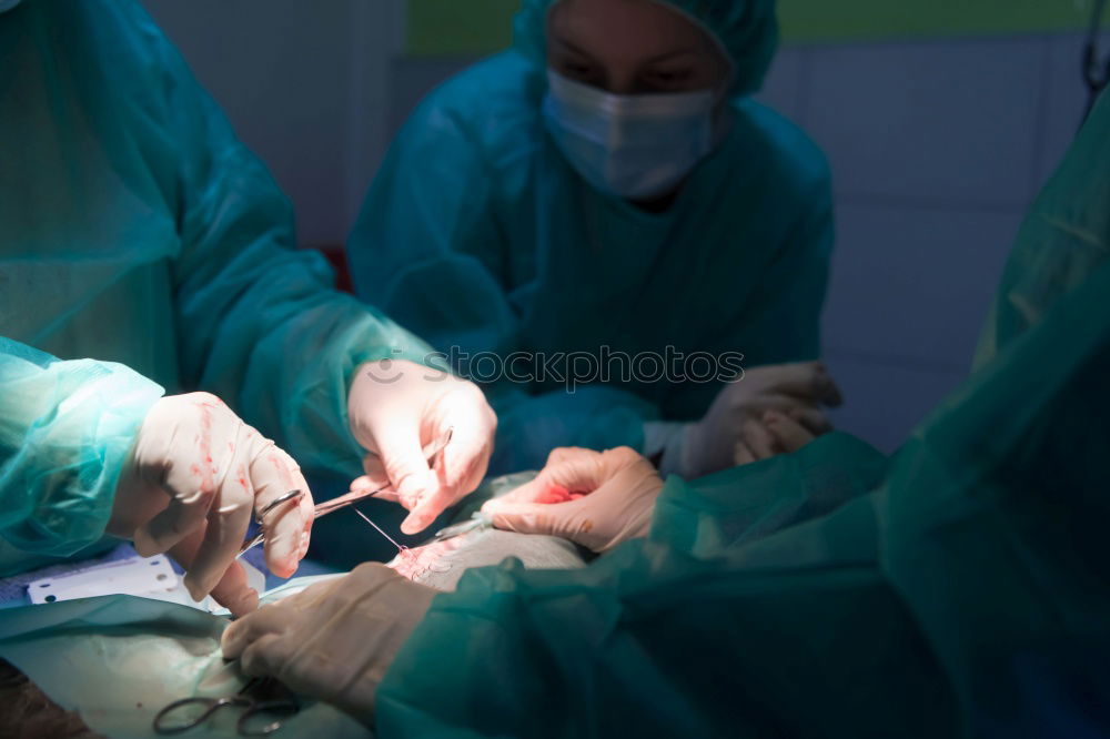 Similar – Image, Stock Photo Team of Surgeons Operating.