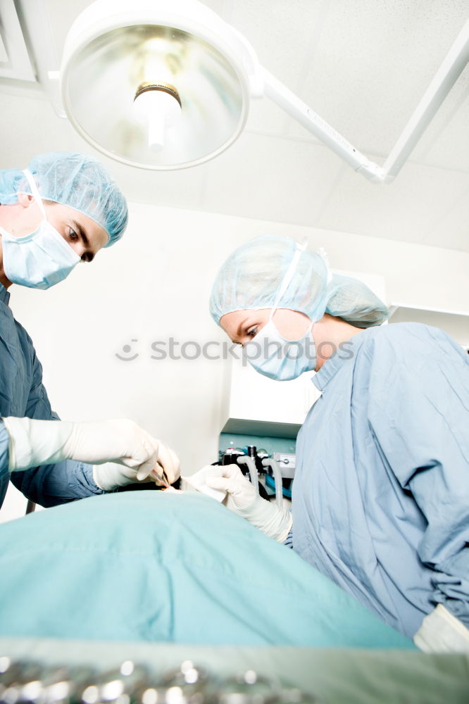 Similar – Image, Stock Photo Team of Surgeons Operating.