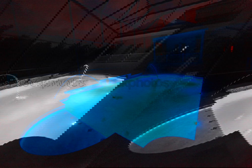 Similar – Image, Stock Photo Pool, sunbeds and umbrellas at night. Night lights.