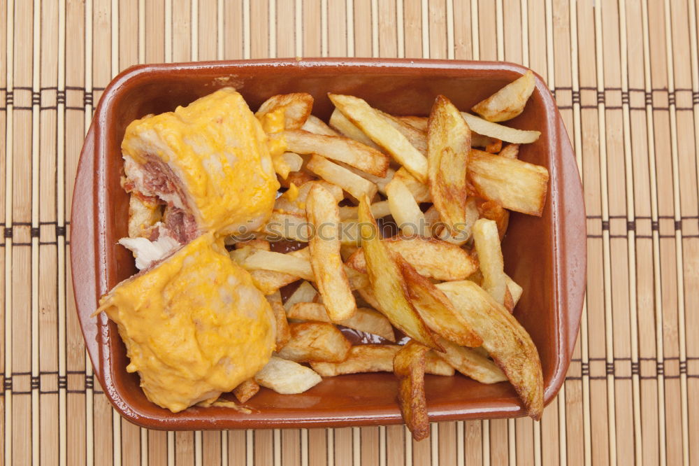 Similar – Salchipapas (Fries with Sausage) South American Fast Food