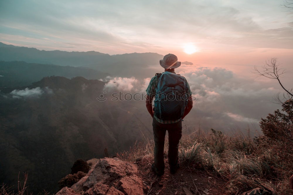 Similar – Man admiring view on cliff