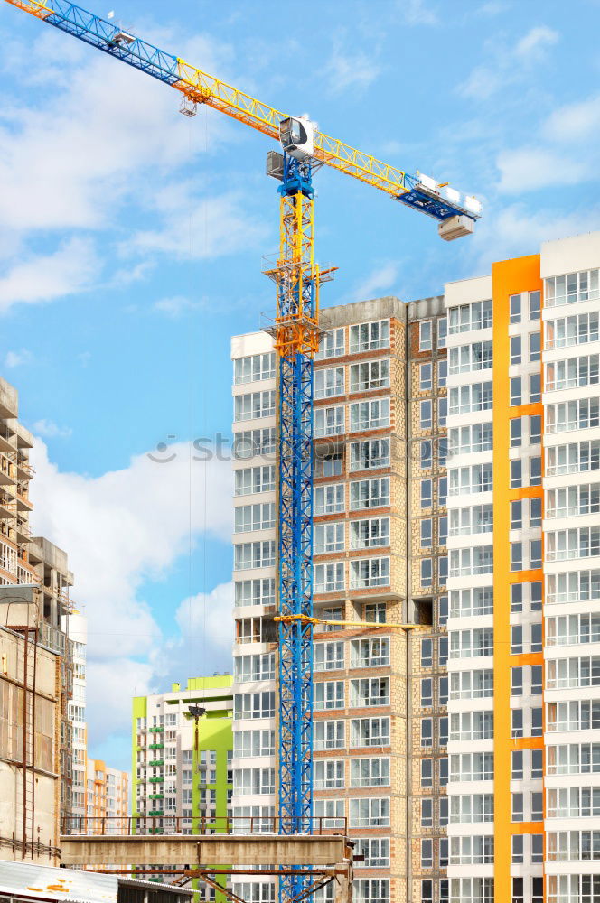 Similar – Construction site with building cranes