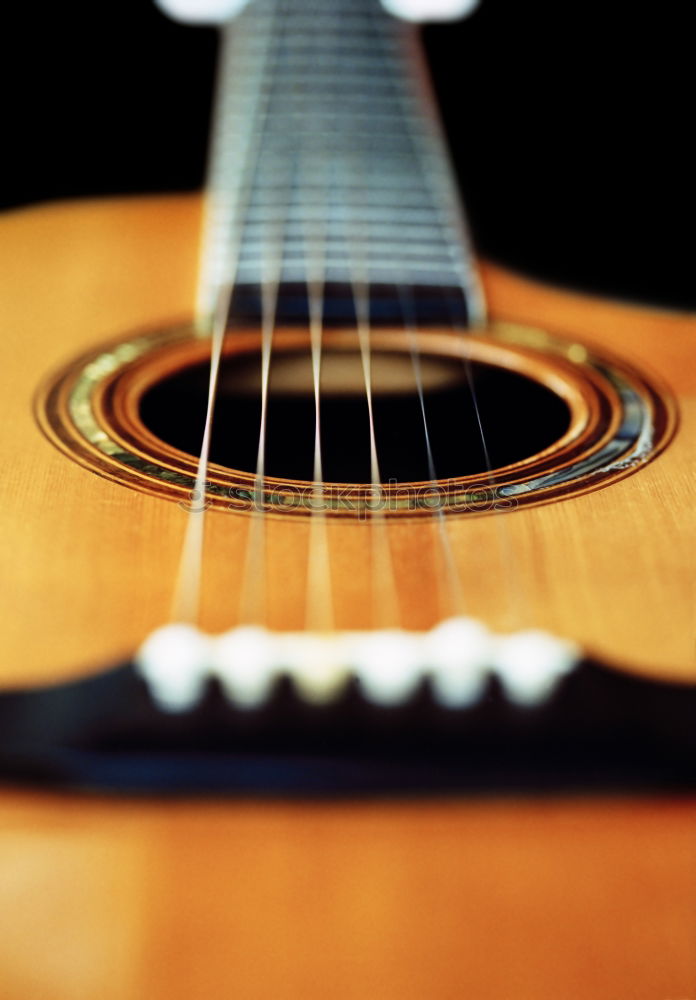 Similar – Image, Stock Photo Ukulele Hawaiian small guitar music instrument at sunset closeup photo. Beige brown gold colour palette shot with ukulele lying on windowsill in soft natural light.