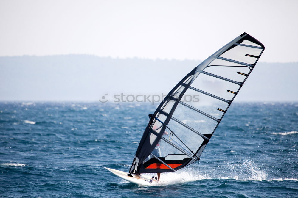 Similar – Hart im Wind Surfer Meer