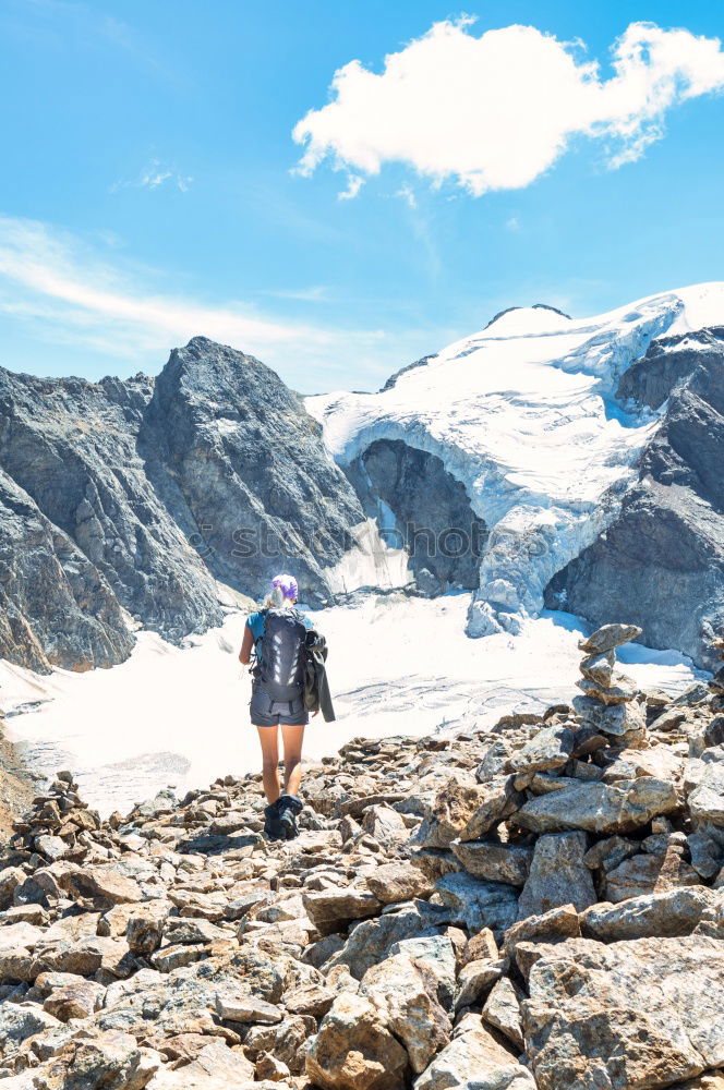 Similar – Tourist standing in mountains