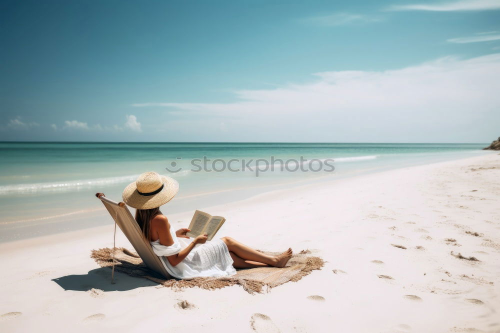 Similar – Reading on the beach Beach