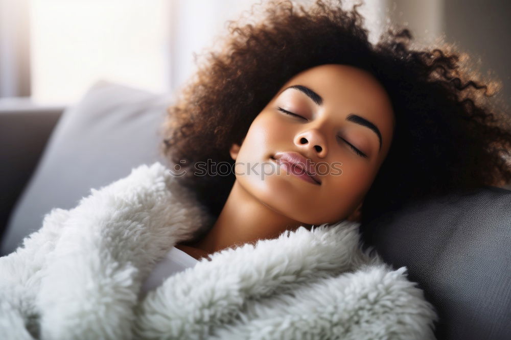 Similar – close up of a pretty black woman with curly hair smiling and lying on bed looking away