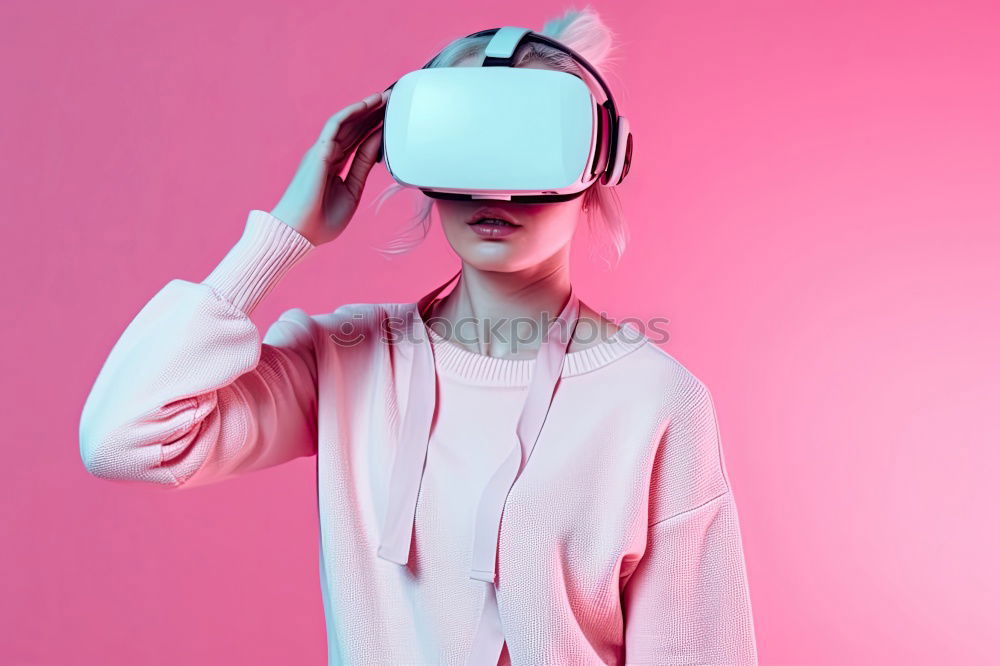 Similar – Image, Stock Photo Boy with virtual reality glasses on colorful background. Future technology, VR concept