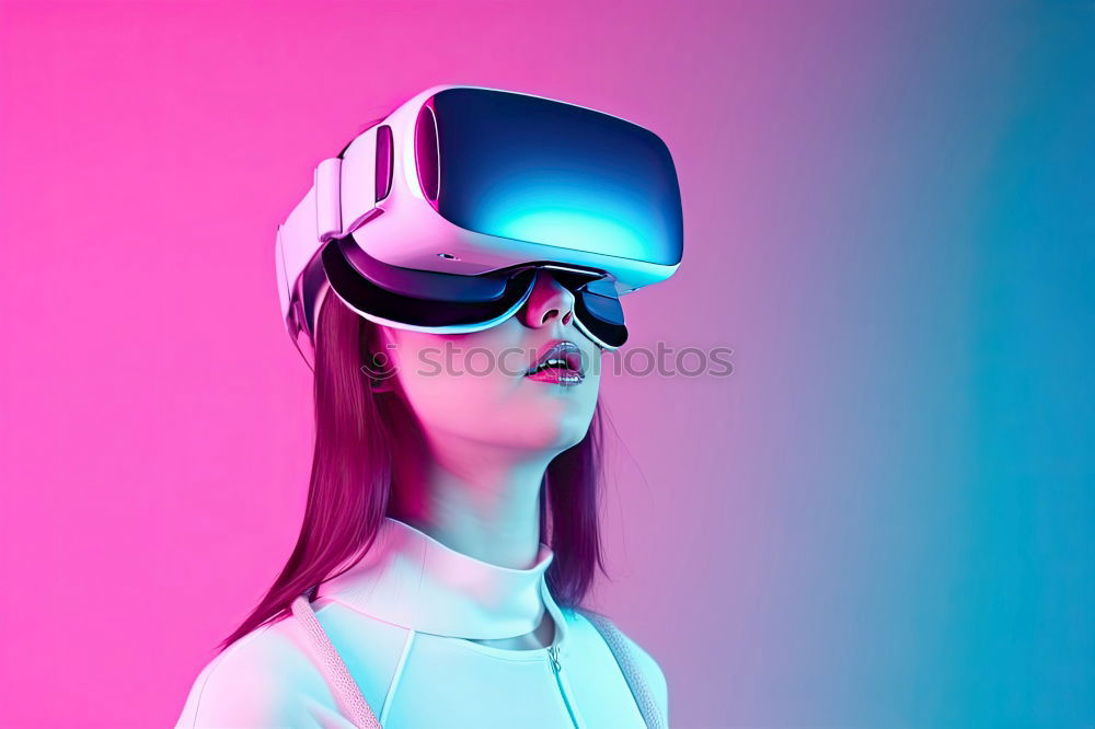 Similar – Image, Stock Photo Boy with virtual reality glasses on colorful background. Future technology, VR concept