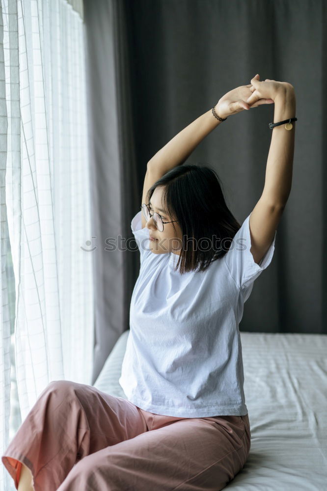 Similar – Woman stretching in bed