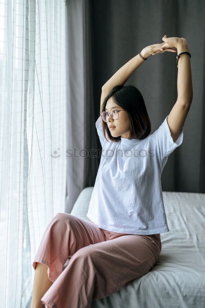 Similar – Woman stretching in bed