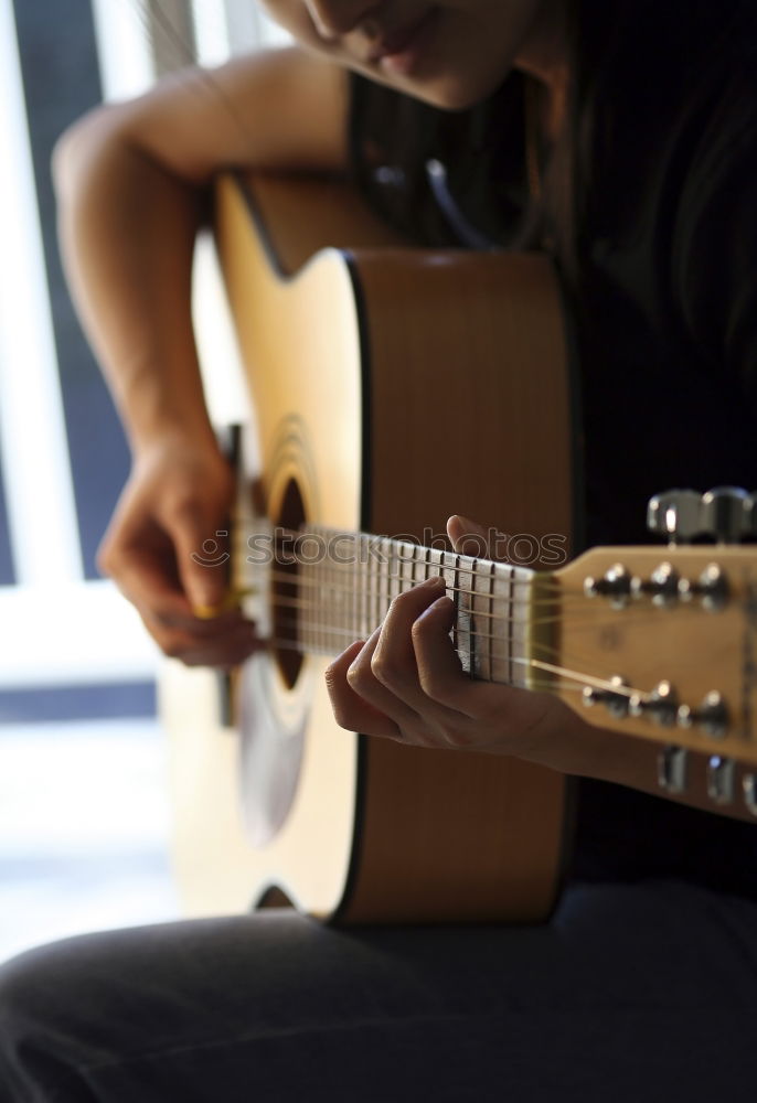 Similar – Image, Stock Photo Man playing guitar and composing music at home near a bright window on a sunny day. Casual musician sitting on the floor playing the guitar.