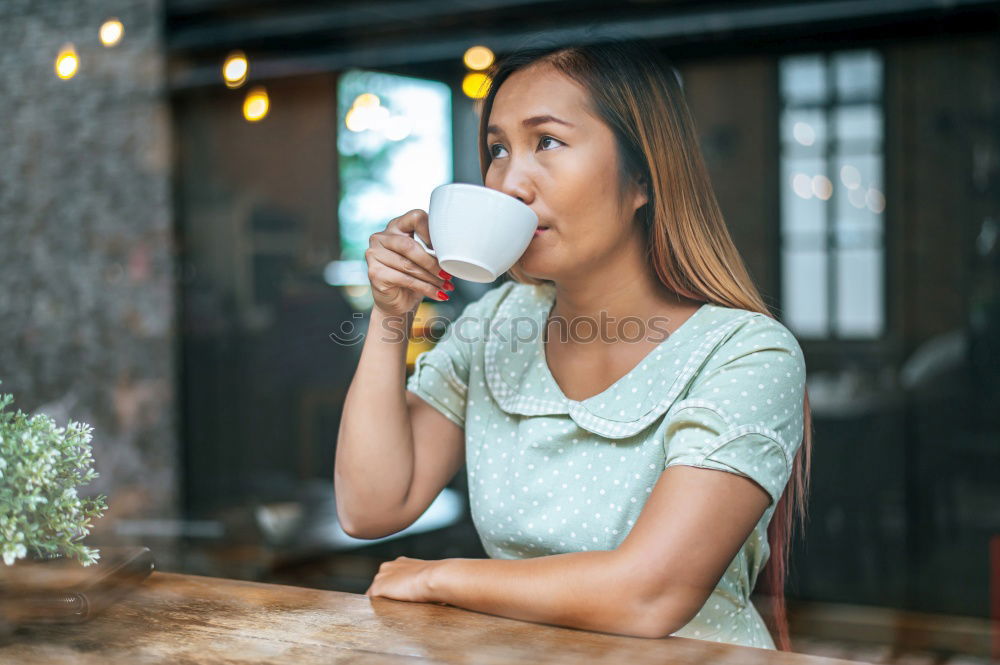 Similar – Ethnic woman stirring cup of coffee