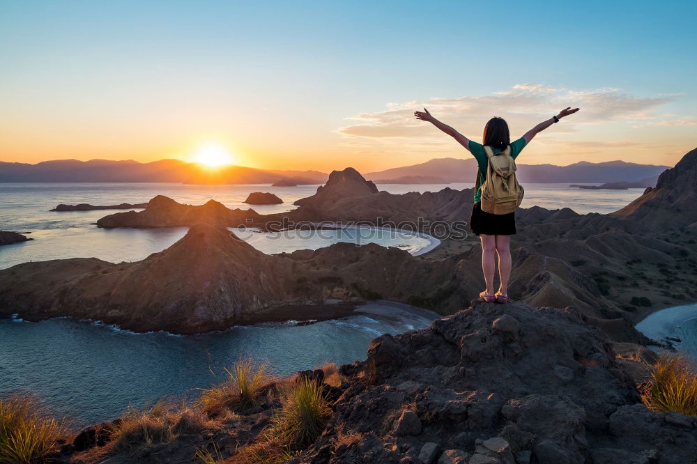 Similar – Tourist jumping over gorge