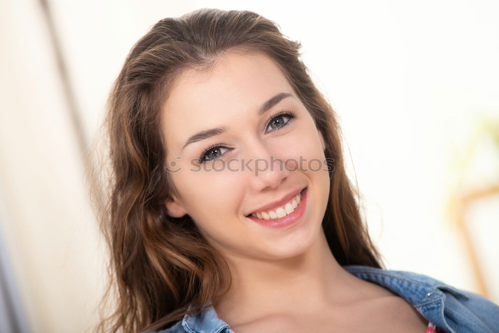 Similar – Close-up portrait of young woman with beautiful blue eyes