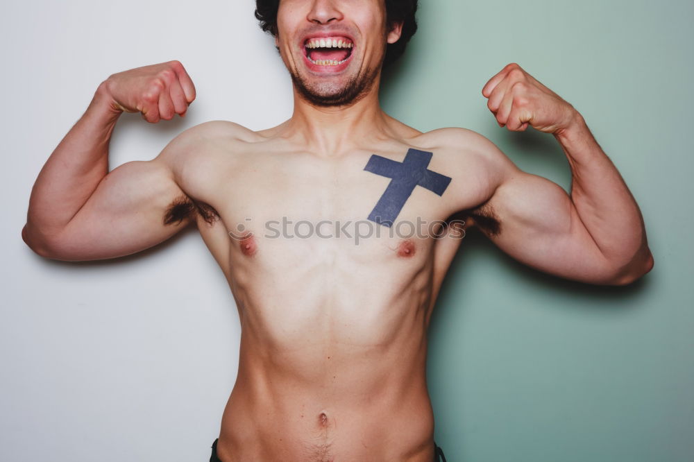 Similar – Image, Stock Photo young man spreads his arms like an angel while leaning against the wall with a tattoo on his bare chest