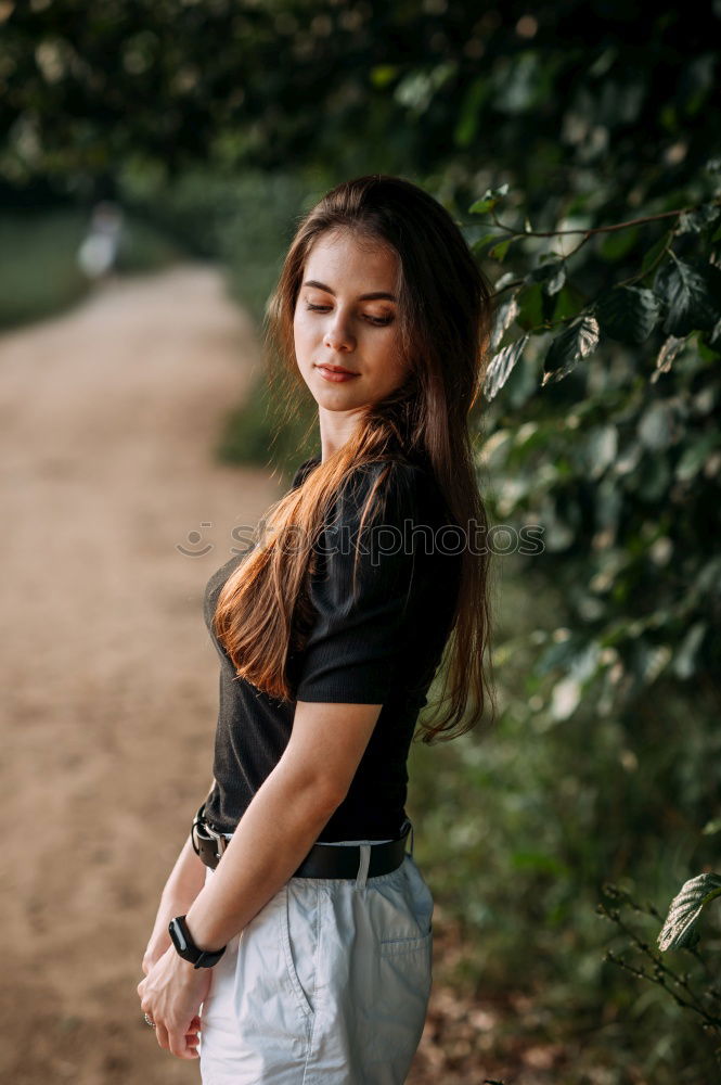 Similar – Blonde woman posing in nature, with the forest in the background