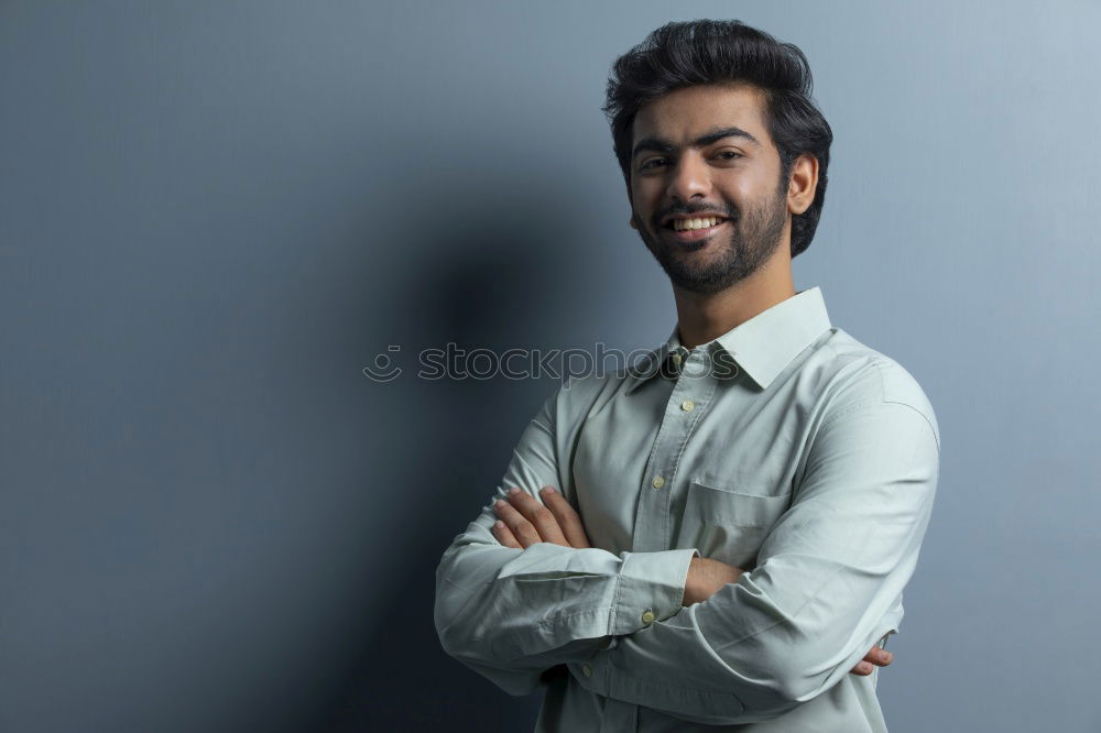 Similar – Young smiling man wearing modern shirt in the street