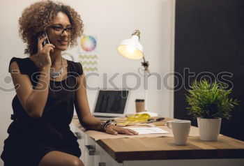 Black woman with afro hair drinking a coffee