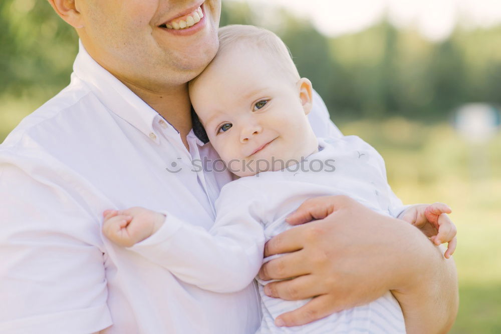 young dad and son playing outdoors at sunset. family concept