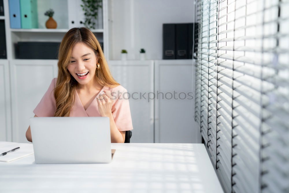 Young beautiful blonde woman on the computer working