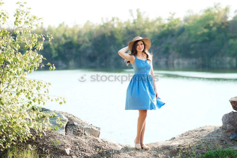 Similar – Image, Stock Photo Young woman in summer dress sitting on the banks of the Rhine with her feet in the river