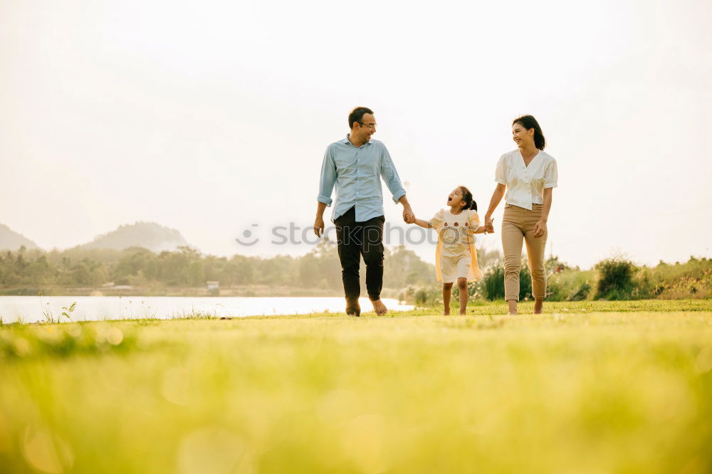 Similar – Image, Stock Photo Happy family standing near the lake at the day time.