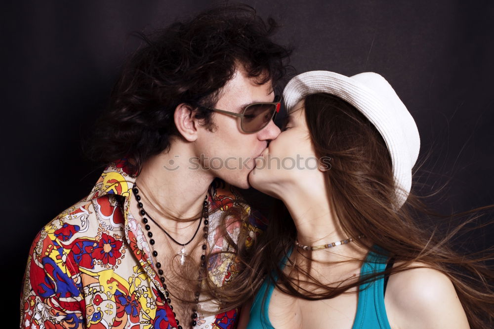 Similar – Image, Stock Photo Kissing couple at stone wall with metal decorated bars