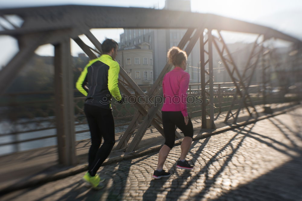 Similar – Active young couple jogging in an urban street