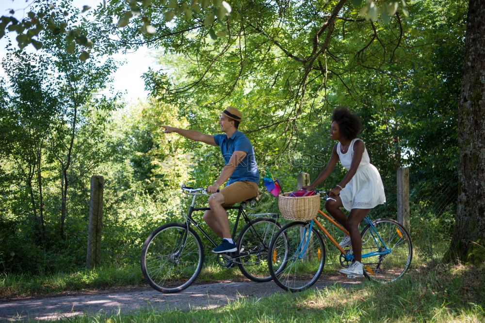 Similar – Image, Stock Photo Women with bikes browsing smartphone