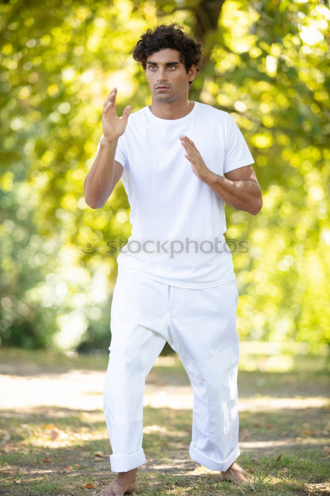 Similar – Fit shirtless young black man doing stretching