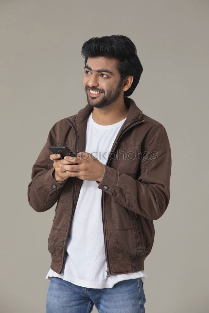 Similar – Young smiling man wearing modern shirt in the street