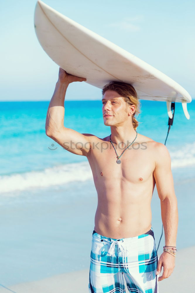 Similar – Young attractive surfer holding his surfboard at the beach