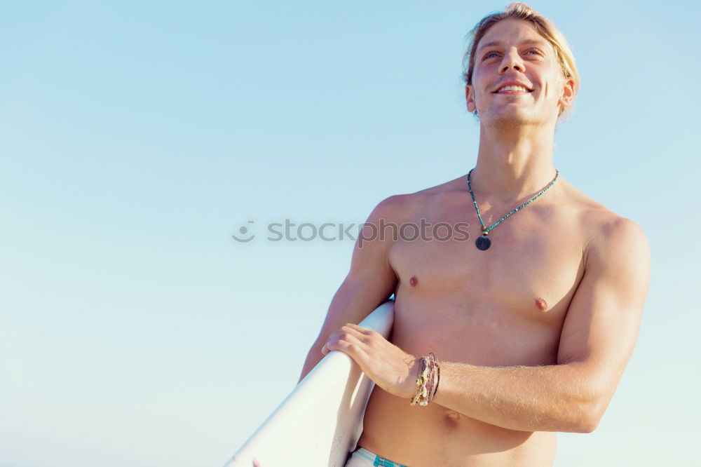 Similar – Young attractive surfer holding his surfboard at the beach