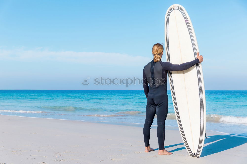 Similar – Image, Stock Photo swimmer putting on his wetsuit on the beach