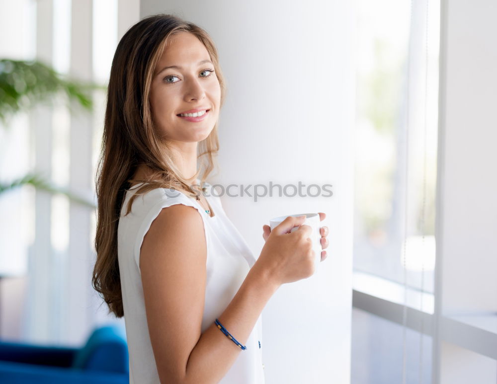 Similar – Young thoughtful woman looking through the window