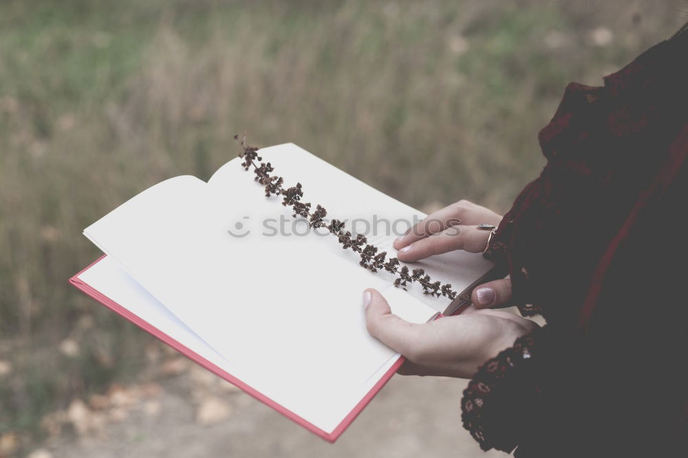 Similar – Image, Stock Photo Young hiking woman taking notes in the nature