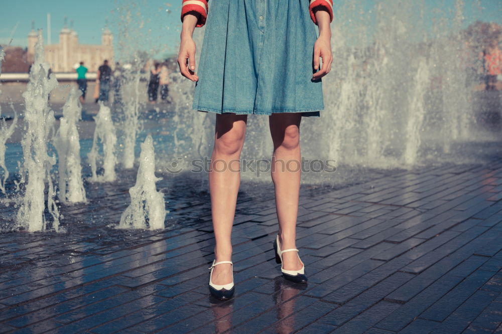 Similar – Image, Stock Photo Woman with long brunette waving hair and pink dress dancing barefoot on a large paved square against the light