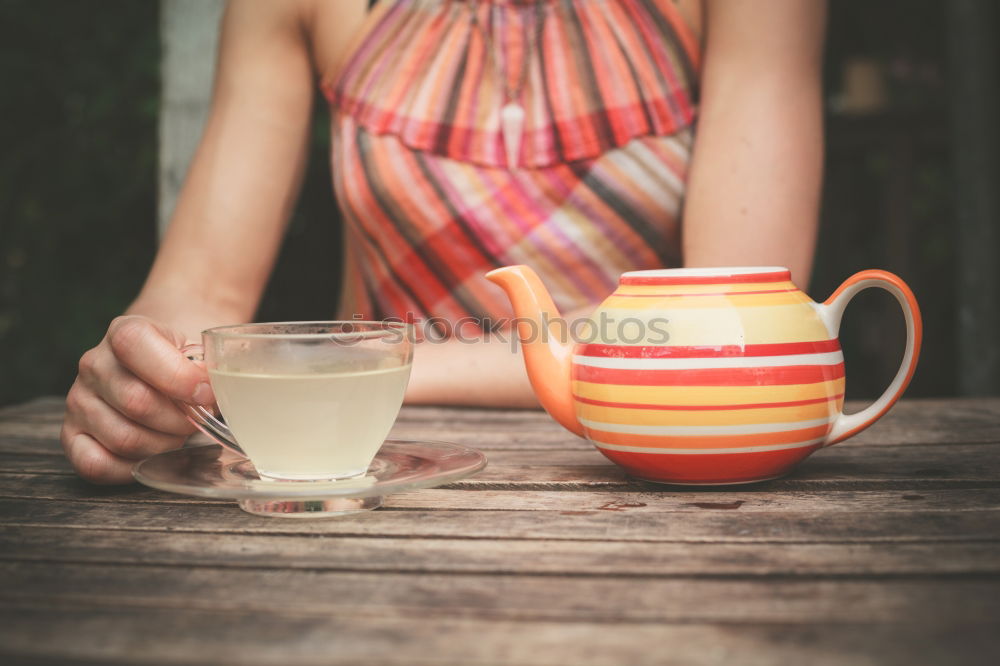 Similar – Image, Stock Photo Turquoise coffee mug held by hands of young woman in yellow pigtail sweater