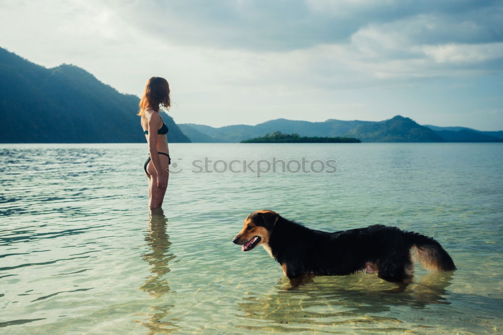 Similar – Image, Stock Photo Women entering water of ocean