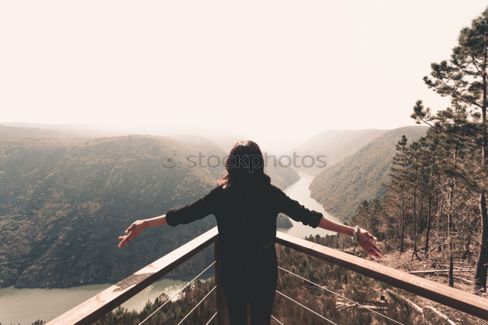 Similar – Man admiring view on cliff