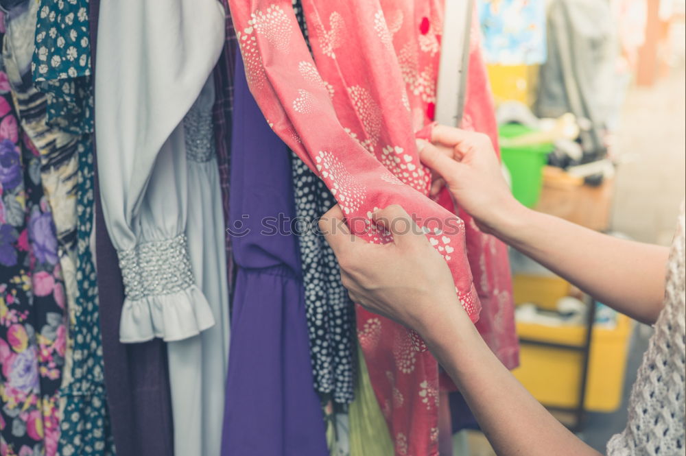 Similar – Woman smelling flower on market