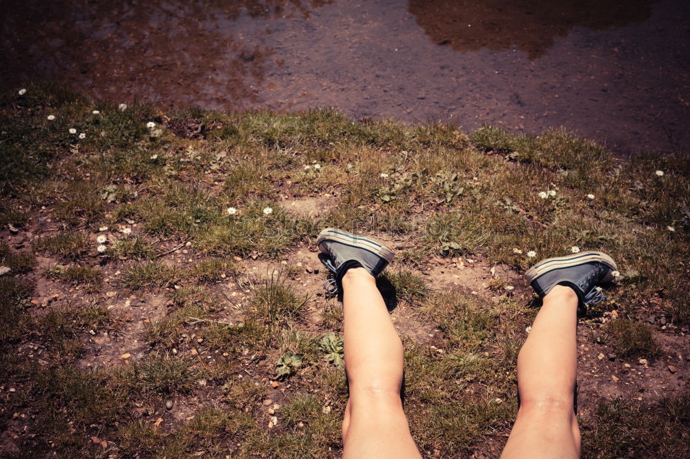 Similar – Image, Stock Photo A woman is standing in the snow.  Next to her two empty footprints. She wears black and white striped stockings and purple boots.