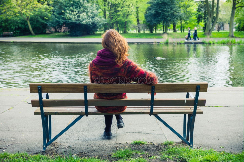 Similar – Woman enjoys sun on park bench