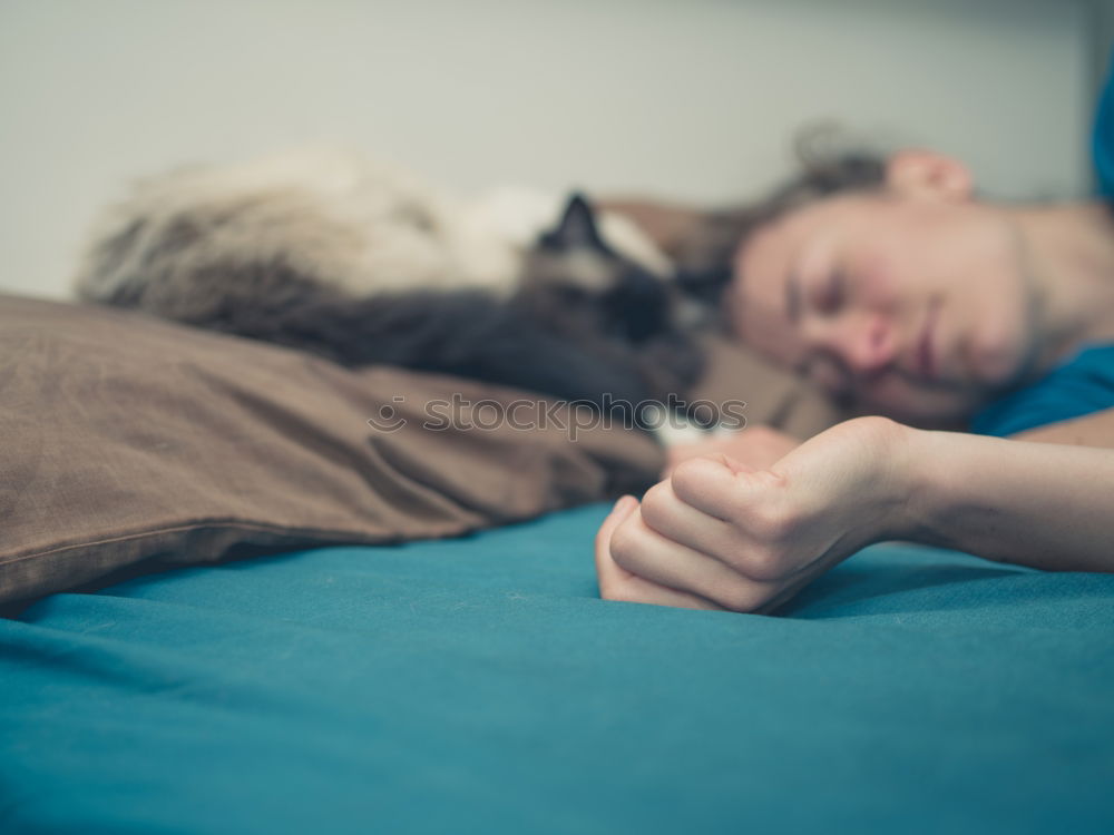 Similar – Image, Stock Photo Young man sleeping with his dog