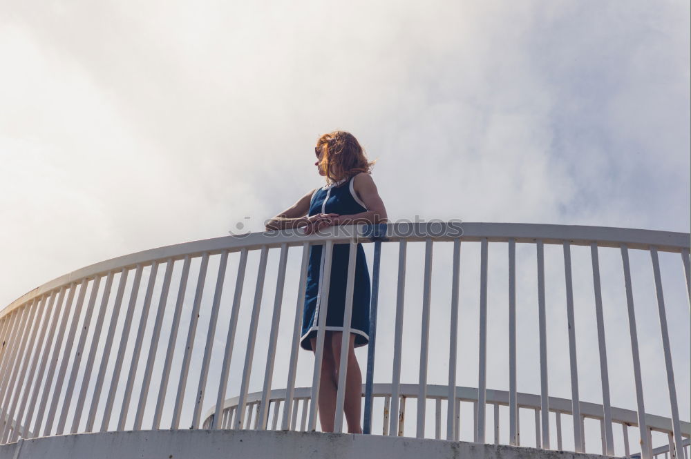 Young Lady standing on a roof