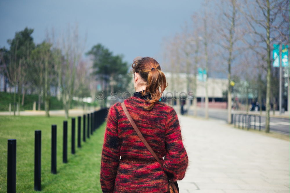 Similar – Woman lies at the river