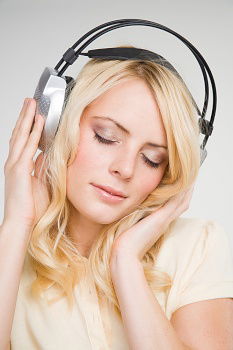 Similar – Image, Stock Photo Pretty blonde woman listening to music on couch at home