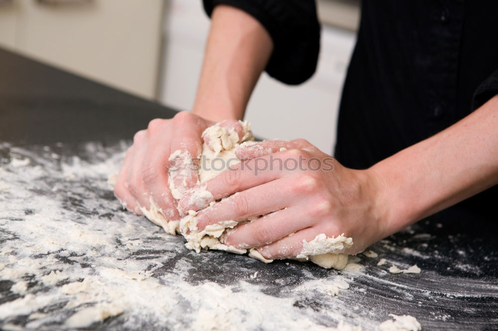 Similar – Woman kneading bread dough