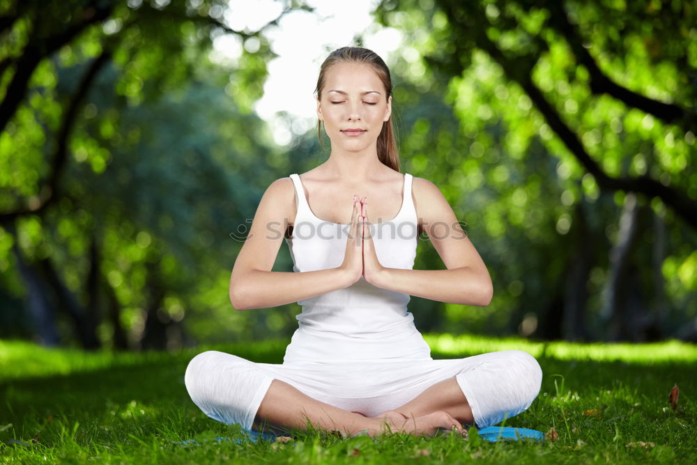 Similar – Young woman doing yoga in nature. Lotus figure.